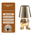 Tischlampe mit goldfarbener Figur